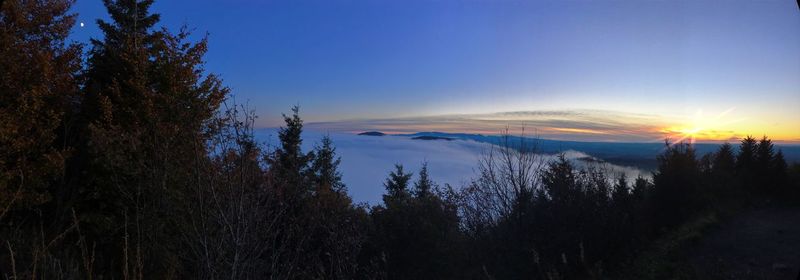 Scenic view of landscape against sky at sunset