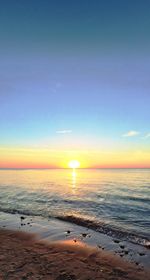 Scenic view of sea at sunset