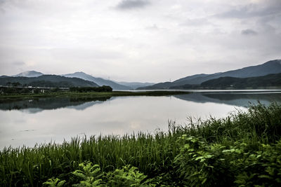 Scenic view of lake against mountain range