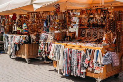 Multi colored flags hanging at market stall