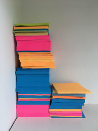 Stack of colorful papers on table