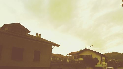 Low angle view of building against sky at sunset