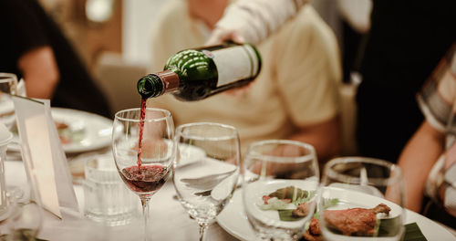 Close-up of wine glasses on table at restaurant