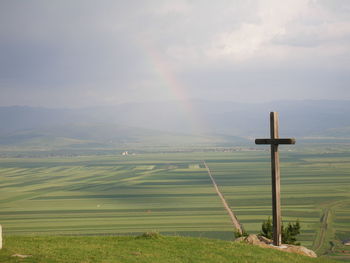 Scenic view of landscape against cloudy sky