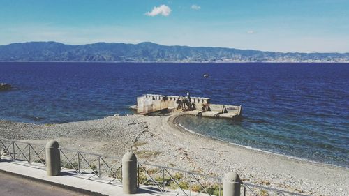 Scenic view of sea against blue sky