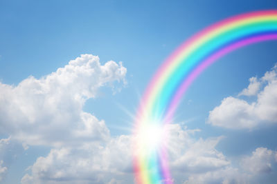 Low angle view of rainbow in sky