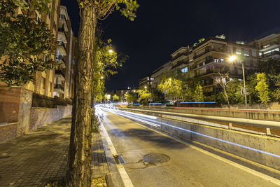 Time lapse lights and streets in the city of barcelona at night