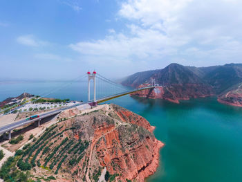 View of suspension bridge over sea