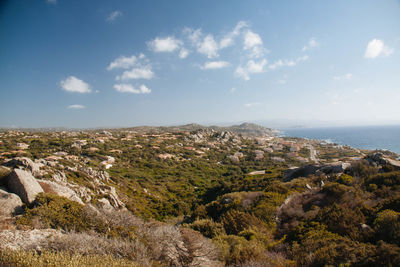 Aerial view of landscape and sea against sky