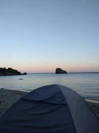 Scenic view of sea against clear sky during sunset