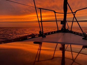 Scenic view of sea against orange sky