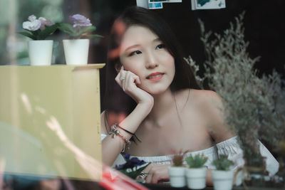 Portrait of young woman looking away