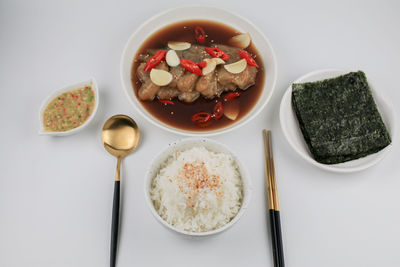 High angle view of food in bowl on white background