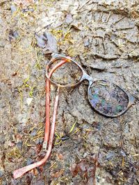 High angle view of rusty metal on field