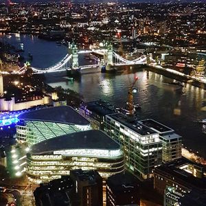 High angle view of illuminated city buildings at night