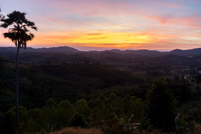 Scenic view of mountains against sky during sunset