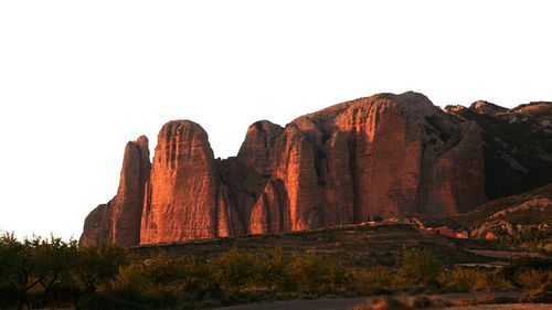 Rock formations in desert against sky