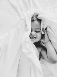 Cute boy sleeping on bed