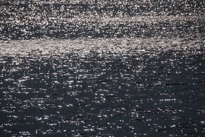 Full frame shot of wet glass at night