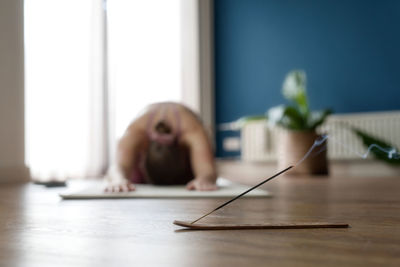 Low section of woman sitting on floor