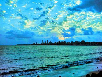 Scenic view of sea against blue sky