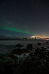 Scenic view of sea against sky at night