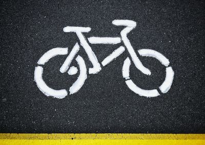 High angle view of arrow symbol on street