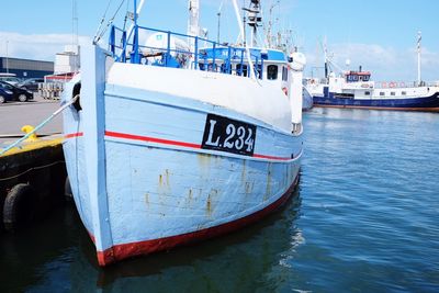 Boats moored at harbor