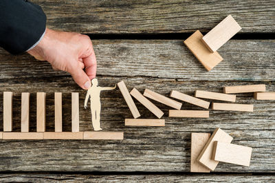 High angle view of person hand on table