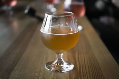 Close-up of wine in glass on table