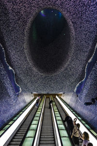 High angle view of escalator at illuminated tunnel