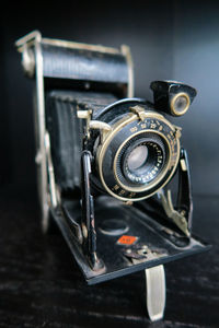 Close-up of camera on table