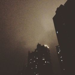 Low angle view of building against sky at night