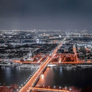 High angle view of illuminated buildings in city at night