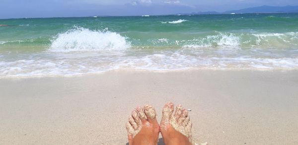 Low section of person on beach