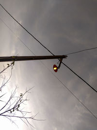 Low angle view of street light against sky