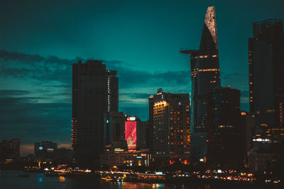 Illuminated buildings in city at night