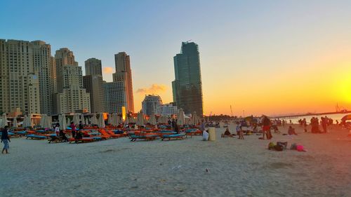 People in city at sunset