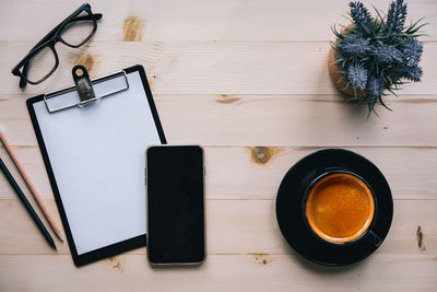 High angle view of coffee cup on table