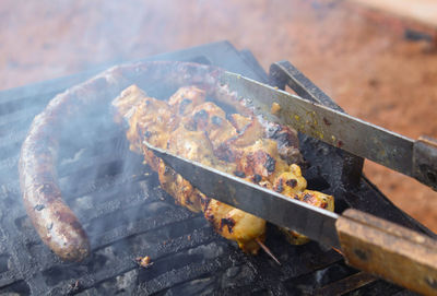 Rosaries on braaier during a braai