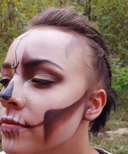 Close-up of young woman with face paint
