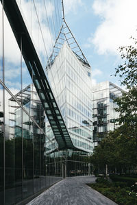 Low angle view of modern buildings against sky