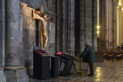 Statue of buddha against building