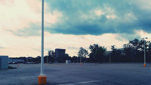 City street against cloudy sky