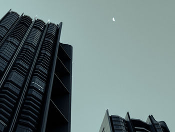 Low angle view of modern buildings against clear sky