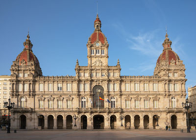 Facade of historic building against sky