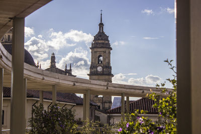 Historic bell tower against sky in city