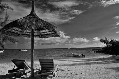 View of calm beach against the sky