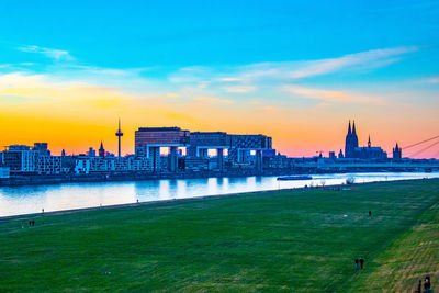 Buildings in city at sunset