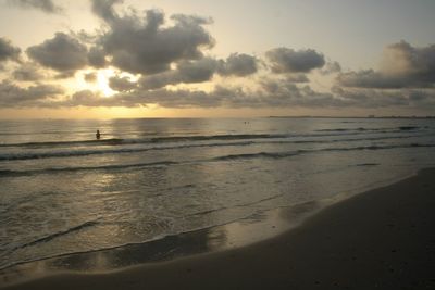 View of calm beach at sunset